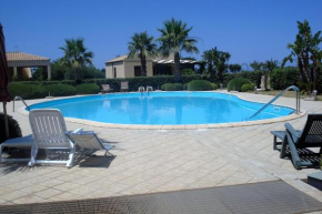 Отель  Casa Vacanze Libeccio - Villetta con giardino e piscina condominiale  Кустоначи